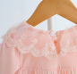 Preview: Süsses Babykleidchen, langärmlig mit kleiner Teddy-Brosche, elfenbein oder rosa
